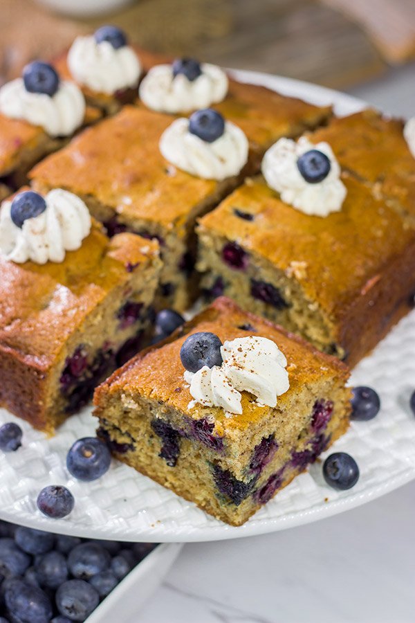 Packed with fresh blueberries and topped with a dollop of ginger whipped cream, this Blueberry Breakfast Cake is a great way to start a summer weekend morning!