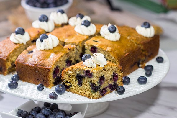 Packed with fresh blueberries and topped with a dollop of ginger whipped cream, this Blueberry Breakfast Cake is a great way to start a summer weekend morning!