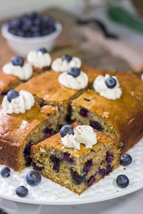 Packed with fresh blueberries and topped with a dollop of ginger whipped cream, this Blueberry Breakfast Cake is a great way to start a summer weekend morning!