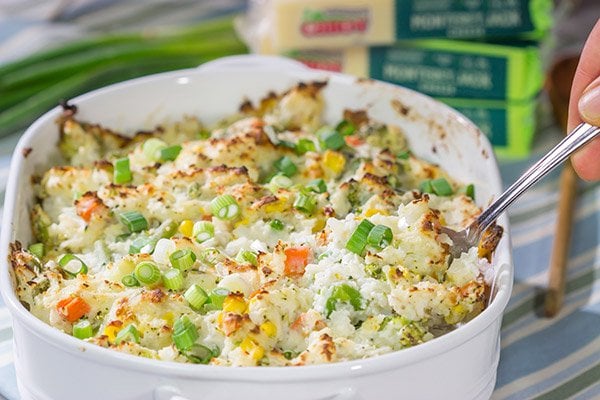 This Cheesy Hash Brown Casserole is a classic Southern recipe - bulked up with veggies and creamy Monterey Jack cheese!  Serve as a side dish or main course!