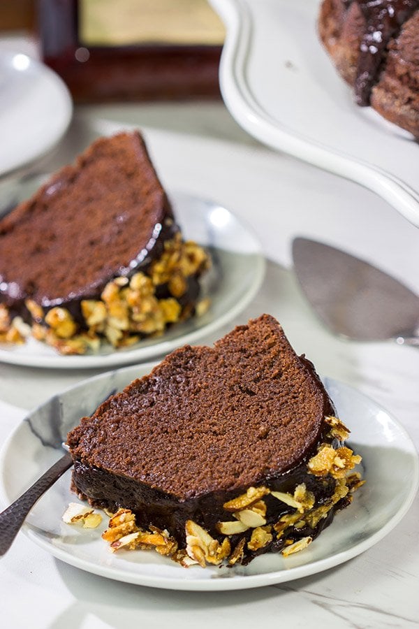 This Chocolate Amaretto Pound Cake is topped with a chocolate amaretto glaze and sprinkled with candied almonds - one bite and you'll be hooked!