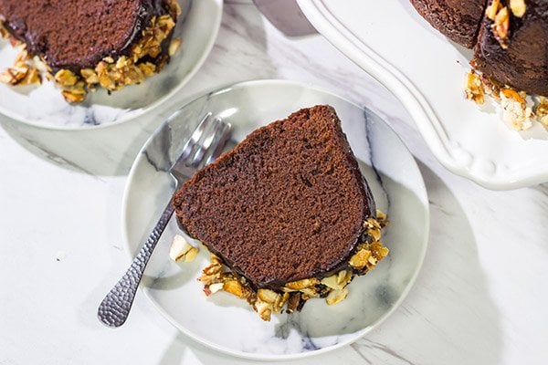 This Chocolate Amaretto Pound Cake is topped with a chocolate amaretto glaze and sprinkled with candied almonds - one bite and you'll be hooked!