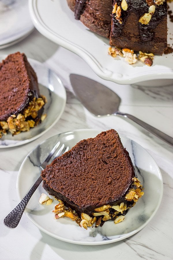 This Chocolate Amaretto Pound Cake is topped with a chocolate amaretto glaze and sprinkled with candied almonds - one bite and you'll be hooked!