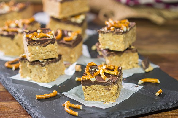 Featuring a tasty combination of peanut butter, chocolate and pretzels, these Chocolate Peanut Butter Pretzel Bars will become a new family favorite!