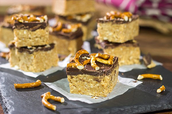 Featuring a tasty combination of peanut butter, chocolate and pretzels, these Chocolate Peanut Butter Pretzel Bars will become a new family favorite!