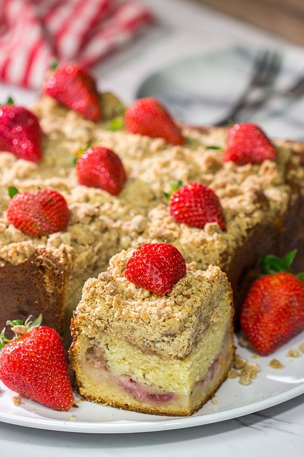 Embrace summer berry season with this Fresh Strawberry Coffee Cake!  This cake is packed with juicy strawberries and topped with a cinnamon-brown sugar crumble.  Happy baking!