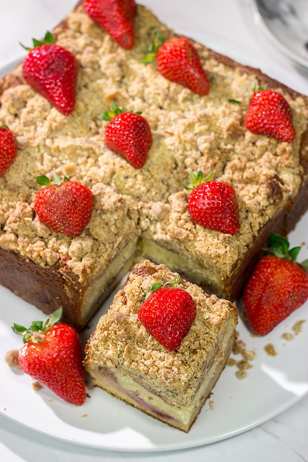 Embrace summer berry season with this Fresh Strawberry Coffee Cake!  This cake is packed with juicy strawberries and topped with a cinnamon-brown sugar crumble.  Happy baking!