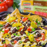 Topped with andouille, Cajun black beans and 2 types of cheese, these Loaded Cajun Nachos make for a delicious appetizer or main course!
