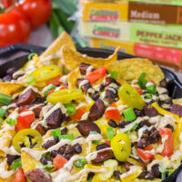 Topped with andouille, Cajun black beans and 2 types of cheese, these Loaded Cajun Nachos make for a delicious appetizer or main course!