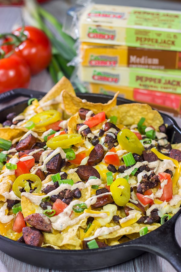 Topped with andouille, Cajun black beans and 2 types of cheese, these Loaded Cajun Nachos make for a delicious appetizer or main course!
