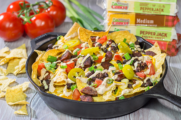 Topped with andouille, Cajun black beans and 2 types of cheese, these Loaded Cajun Nachos make for a delicious appetizer or main course!
