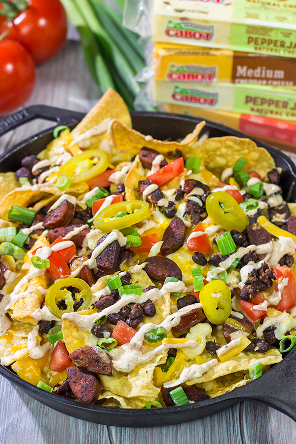 Topped with andouille, Cajun black beans and 2 types of cheese, these Loaded Cajun Nachos make for a delicious appetizer or main course!