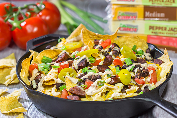 Topped with andouille, Cajun black beans and 2 types of cheese, these Loaded Cajun Nachos make for a delicious appetizer or main course!