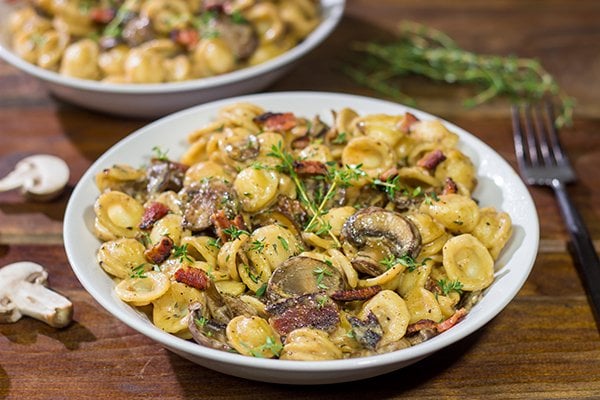 This Orecchiette with Mushroom Thyme Sauce features pasta coated with a creamy, flavorful sauce - and it's easy enough to make for a weeknight meal!