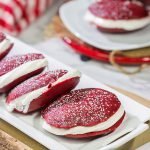 Put a red velvet spin on a classic baked treat!  These Red Velvet Whoopie Pies are filled with a marshmallow cream cheese frosting - they're delicious!
