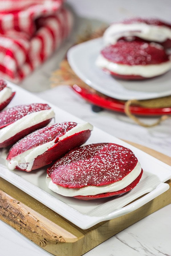 Put a red velvet spin on a classic baked treat!  These Red Velvet Whoopie Pies are filled with a marshmallow cream cheese frosting - they're delicious!