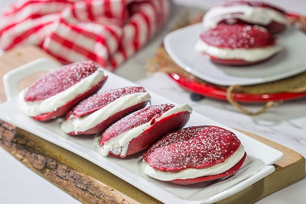 Put a red velvet spin on a classic baked treat!  These Red Velvet Whoopie Pies are filled with a marshmallow cream cheese frosting - they're delicious!