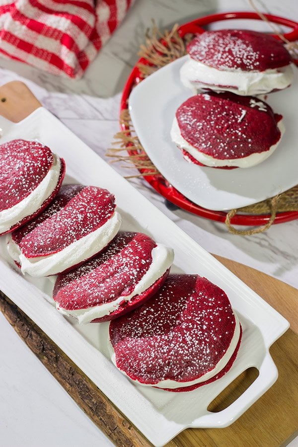 Put a red velvet spin on a classic baked treat!  These Red Velvet Whoopie Pies are filled with a marshmallow cream cheese frosting - they're delicious!