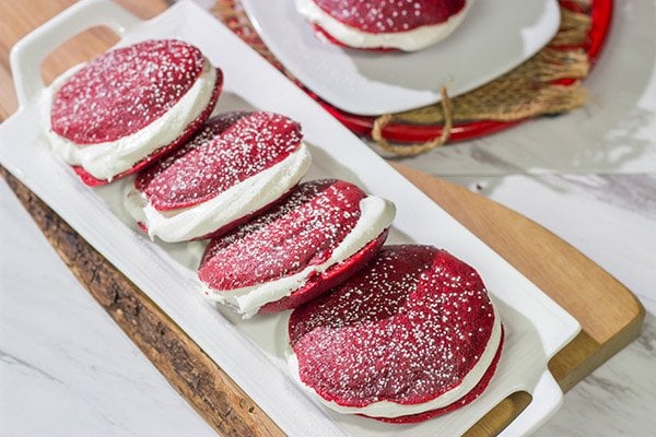 Put a red velvet spin on a classic baked treat!  These Red Velvet Whoopie Pies are filled with a marshmallow cream cheese frosting - they're delicious!