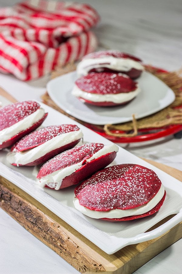 Put a red velvet spin on a classic baked treat!  These Red Velvet Whoopie Pies are filled with a marshmallow cream cheese frosting - they're delicious!