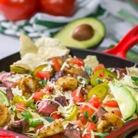 Put a comfort food spin on a classic restaurant favorite. These Surf and Turf Nachos are topped with juicy steak and flavorful shrimp - whip up a batch for dinner this weekend!