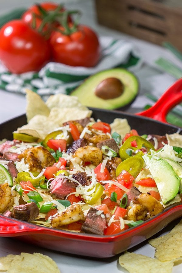 Put a comfort food spin on a classic restaurant favorite. These Surf and Turf Nachos are topped with juicy steak and flavorful shrimp - whip up a batch for dinner this weekend!