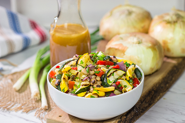 If you're looking for a tasty summer side dish, then look no further!  This Vidalia Onion, Bourbon and Sorghum Vinaigrette with Black Eyed Pea Salad is packed with flavor!