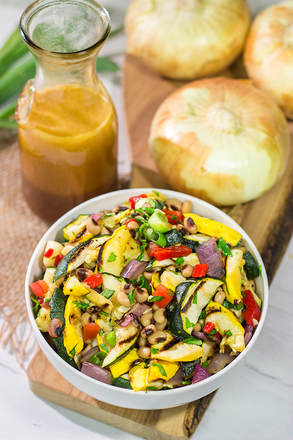 If you're looking for a tasty summer side dish, then look no further!  This Vidalia Onion, Bourbon and Sorghum Vinaigrette with Black Eyed Pea Salad is packed with flavor!