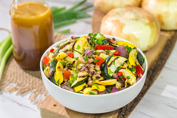 If you're looking for a tasty summer side dish, then look no further!  This Vidalia Onion, Bourbon and Sorghum Vinaigrette with Black Eyed Pea Salad is packed with flavor!