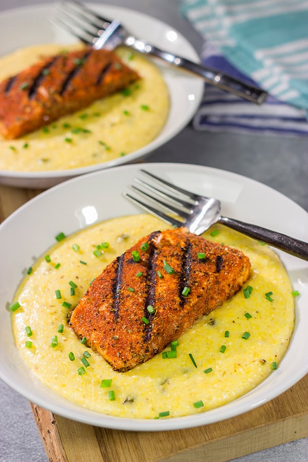 Topped with a flavor-packed piece of Cajun Grilled Salmon, these Cheesy Jalapeno Grits are delicious!  These ain't grandma's grits!