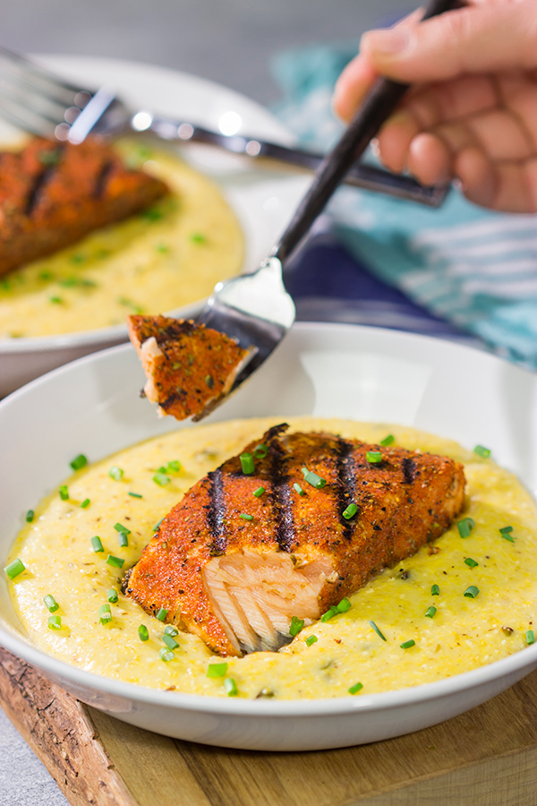 Topped with a flavor-packed piece of Cajun Grilled Salmon, these Cheesy Jalapeno Grits are delicious!  These ain't grandma's grits!