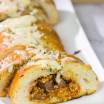 Looking for a fun summer grilling idea?  Fire up the grill and put this Cheesy BBQ Steak Stuffed French Bread on the menu!