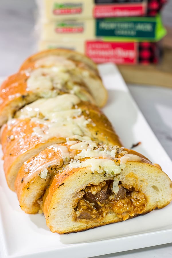 Looking for a fun summer grilling idea?  Fire up the grill and put this Cheesy BBQ Steak Stuffed French Bread on the menu!