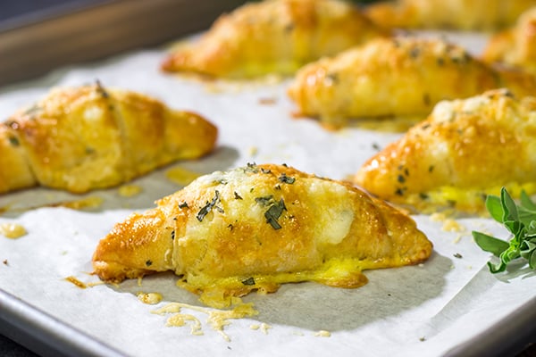 These Cheesy Crescent Rolls feature flaky layers filled with melted cheese...and they can be ready in just 20 minutes!