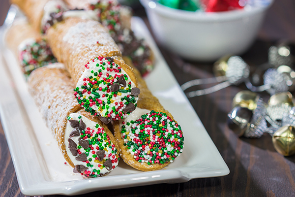 Leave a cannoli for Santa this year!  These Christmas Cannoli are a fun (and easy) way to mix up the traditional Christmas cookie plate.