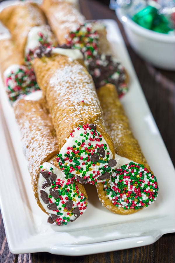 Leave a cannoli for Santa this year!  These Christmas Cannoli are a fun (and easy) way to mix up the traditional Christmas cookie plate.