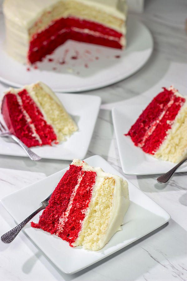 Looking for a fun red velvet dessert idea?  Bake up this Red Velvet Ombre Cake!  It's a tasty dessert with a unique 'wow' factor when you slice into it!