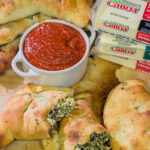 Turn a favorite dip into a meal with a batch of these Spinach Artichoke Calzones!