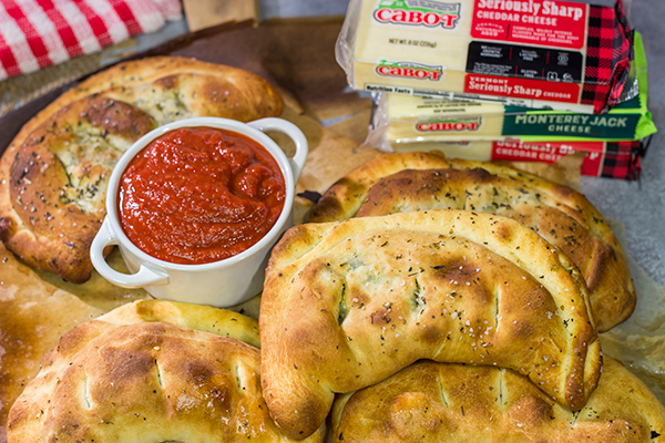 Turn a favorite dip into a meal with a batch of these Spinach Artichoke Calzones!