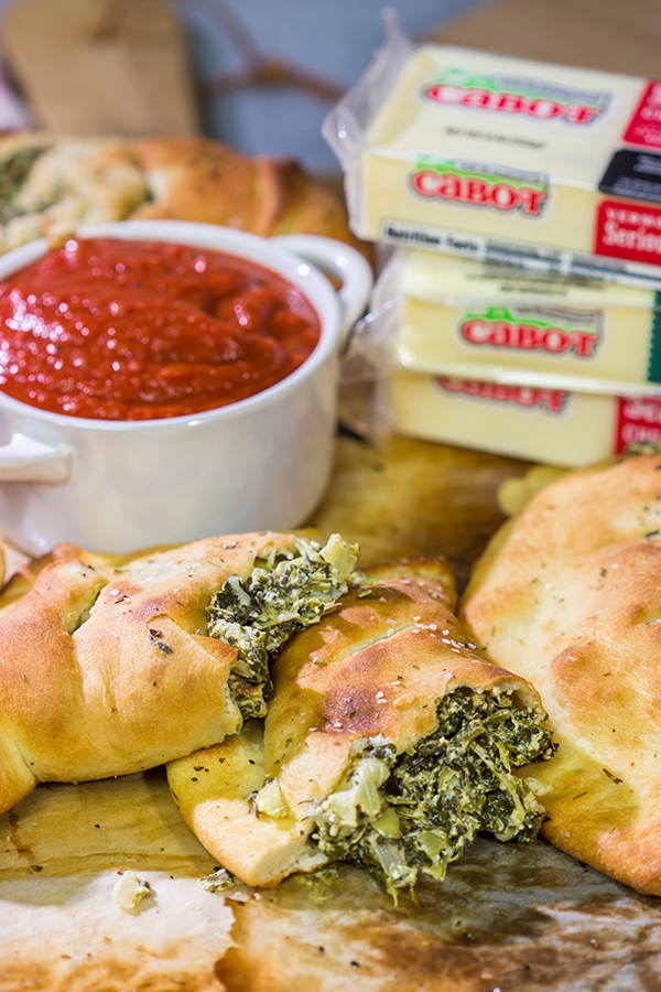 Turn a favorite dip into a meal with a batch of these Spinach Artichoke Calzones!