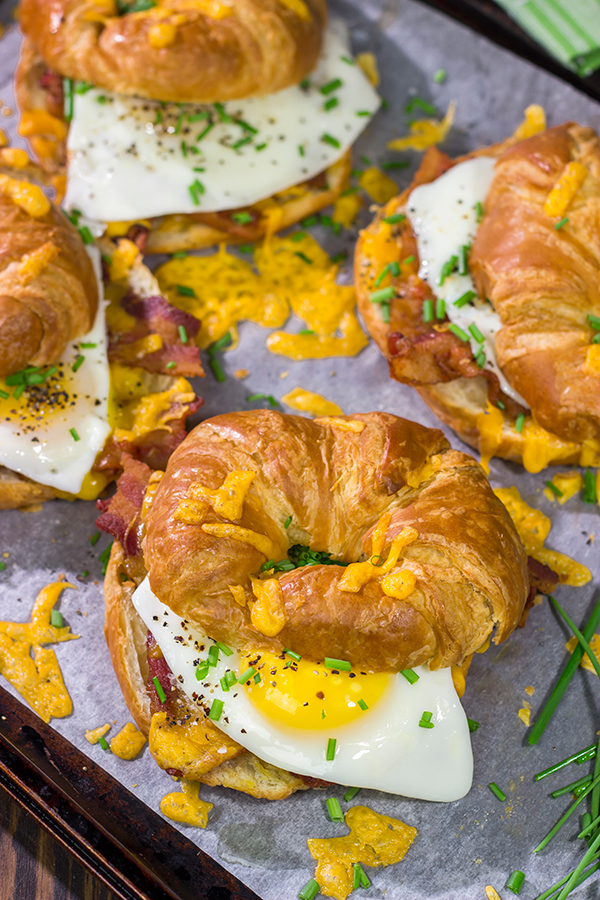 These Bacon and Egg Croissants are an easy and delicious breakfast or brunch recipe! Flaky croissants...melty cheese...crispy bacon...yum!