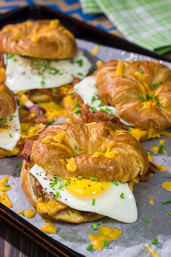 These Bacon and Egg Croissants are an easy and delicious breakfast or brunch recipe! Flaky croissants...melty cheese...crispy bacon...yum!
