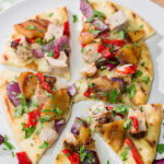 Grilled flatbreads are a fun summer recipe!  These Grilled Pork and Pineapple Flatbreads are packed with flavor...serve 'em as an appetizer or a main dish!