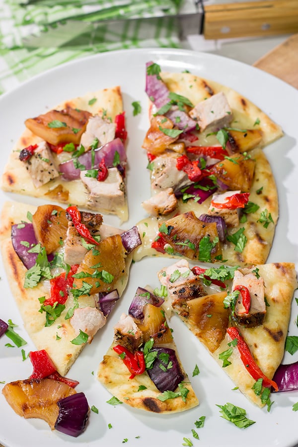 Grilled flatbreads are a fun summer recipe!  These Grilled Pork and Pineapple Flatbreads are packed with flavor...serve 'em as an appetizer or a main dish!
