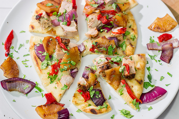 Grilled flatbreads are a fun summer recipe!  These Grilled Pork and Pineapple Flatbreads are packed with flavor...serve 'em as an appetizer or a main dish!