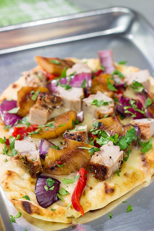 Grilled flatbreads are a fun summer recipe!  These Grilled Pork and Pineapple Flatbreads are packed with flavor...serve 'em as an appetizer or a main dish!