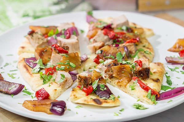 Grilled flatbreads are a fun summer recipe!  These Grilled Pork and Pineapple Flatbreads are packed with flavor...serve 'em as an appetizer or a main dish!