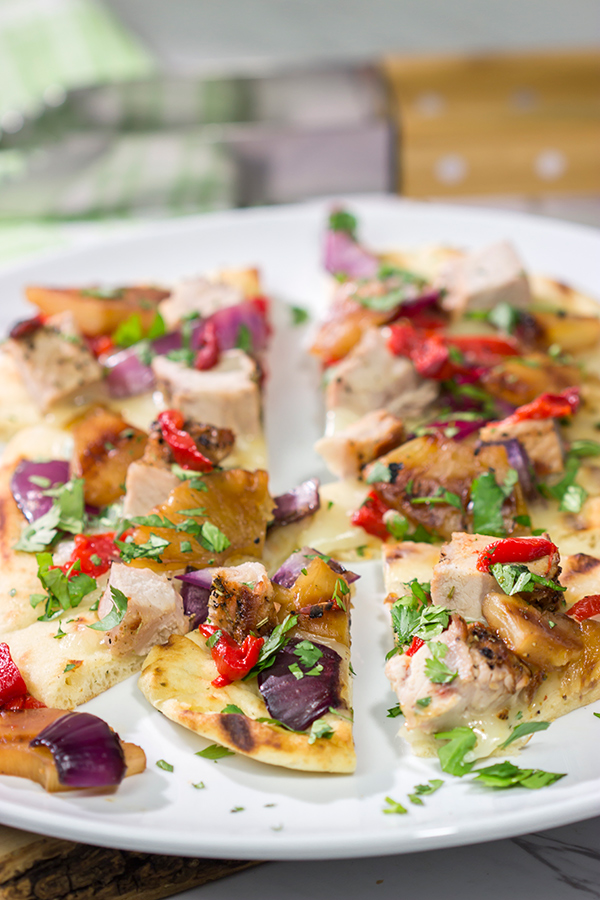 Grilled flatbreads are a fun summer recipe!  These Grilled Pork and Pineapple Flatbreads are packed with flavor...serve 'em as an appetizer or a main dish!