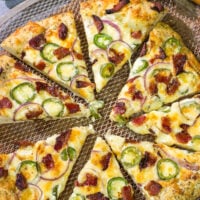 Love jalapeno poppers? Then put this Jalapeno Popper Pizza on the menu! It's a tasty way to mix up Friday night pizza night!