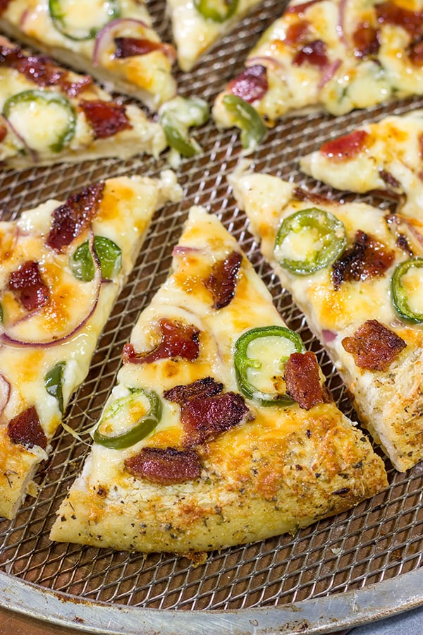 Love jalapeno poppers? Then put this Jalapeno Popper Pizza on the menu! It's a tasty way to mix up Friday night pizza night!